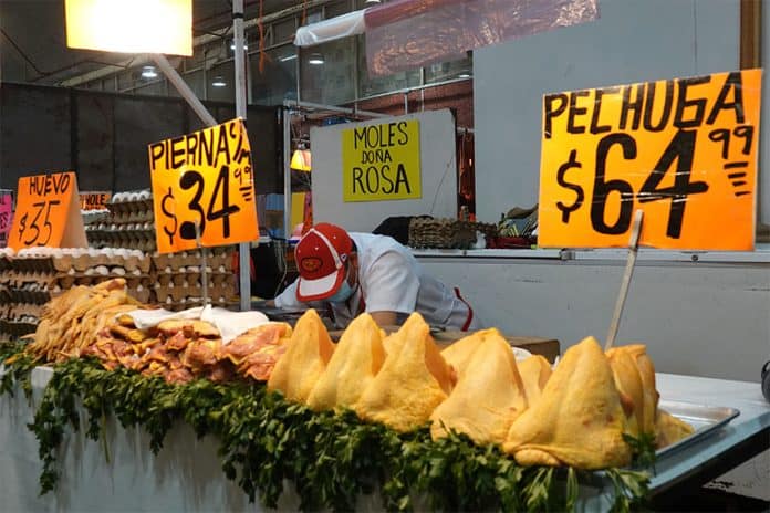 Chicken and pork for sale at a Mexico City market in August 2022.