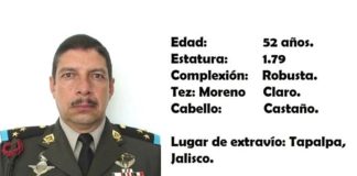A missing person poster for Colonel Grimaldo Muñoz, with his photo, age, height and other details.