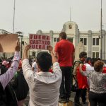 Peruvians gather outside regional headquarters of the Department of Lima to protest on Wednesday after Castillo's attempt to dissolve the national legislature.