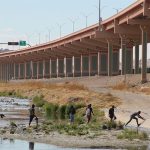 A group of migrants crosses the Rio Grande from Ciudad Juárez to enter the U.S. in March.