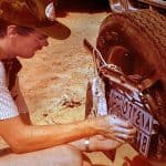 Saudi Arabia resident removing his plates by Saudi law at the Qatar border in 1983.