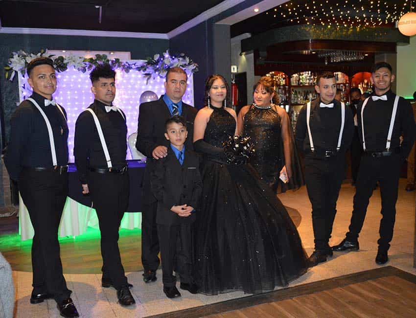 Quinceañera with her chambelenes