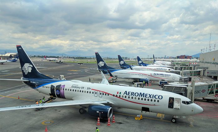 Aeromexico's Boeing 737s lined up at the gates of the international terminal of the Mexico City International Airport (AICM).