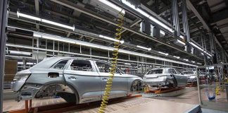 Car bodies on an assembly line in a factory