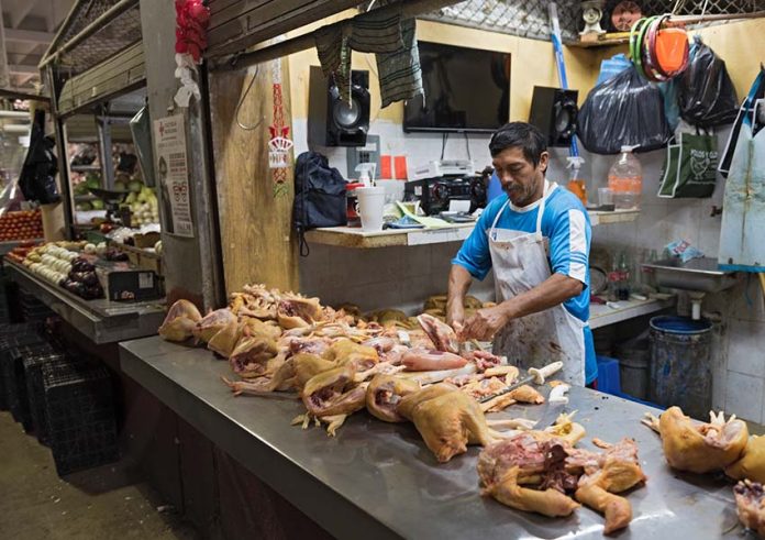 Chicken butcher in Campeche, Mexico, market