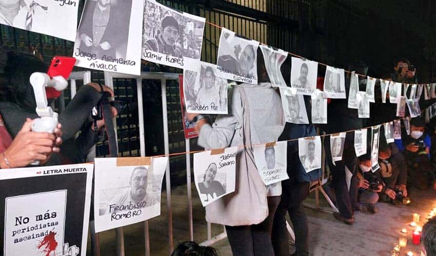 Journalists in front of Mexico's Interior Ministry building protesting lack of safety for media workers.