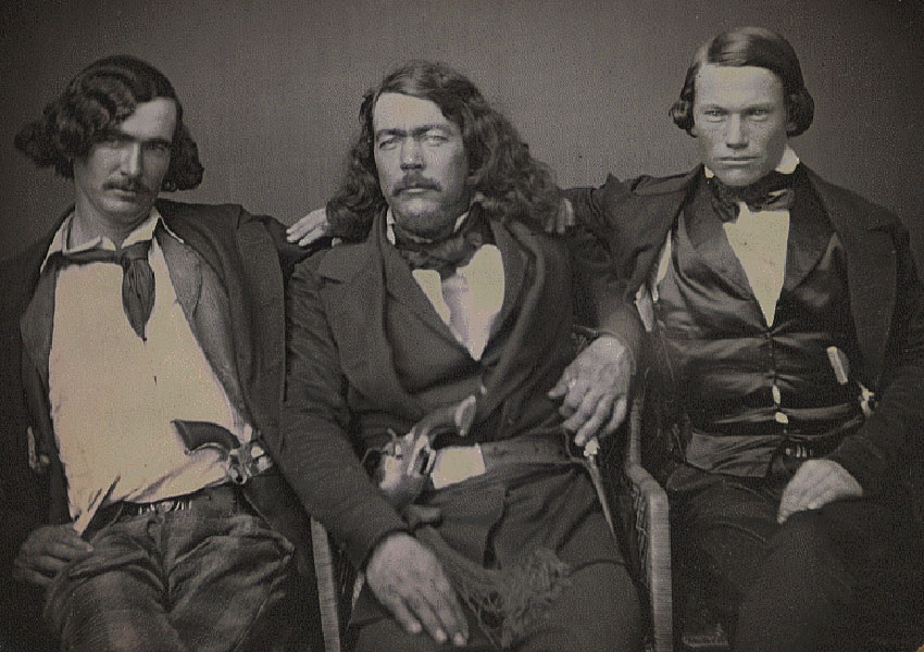 Harry Love, center, posing with two of his California Rangers.
