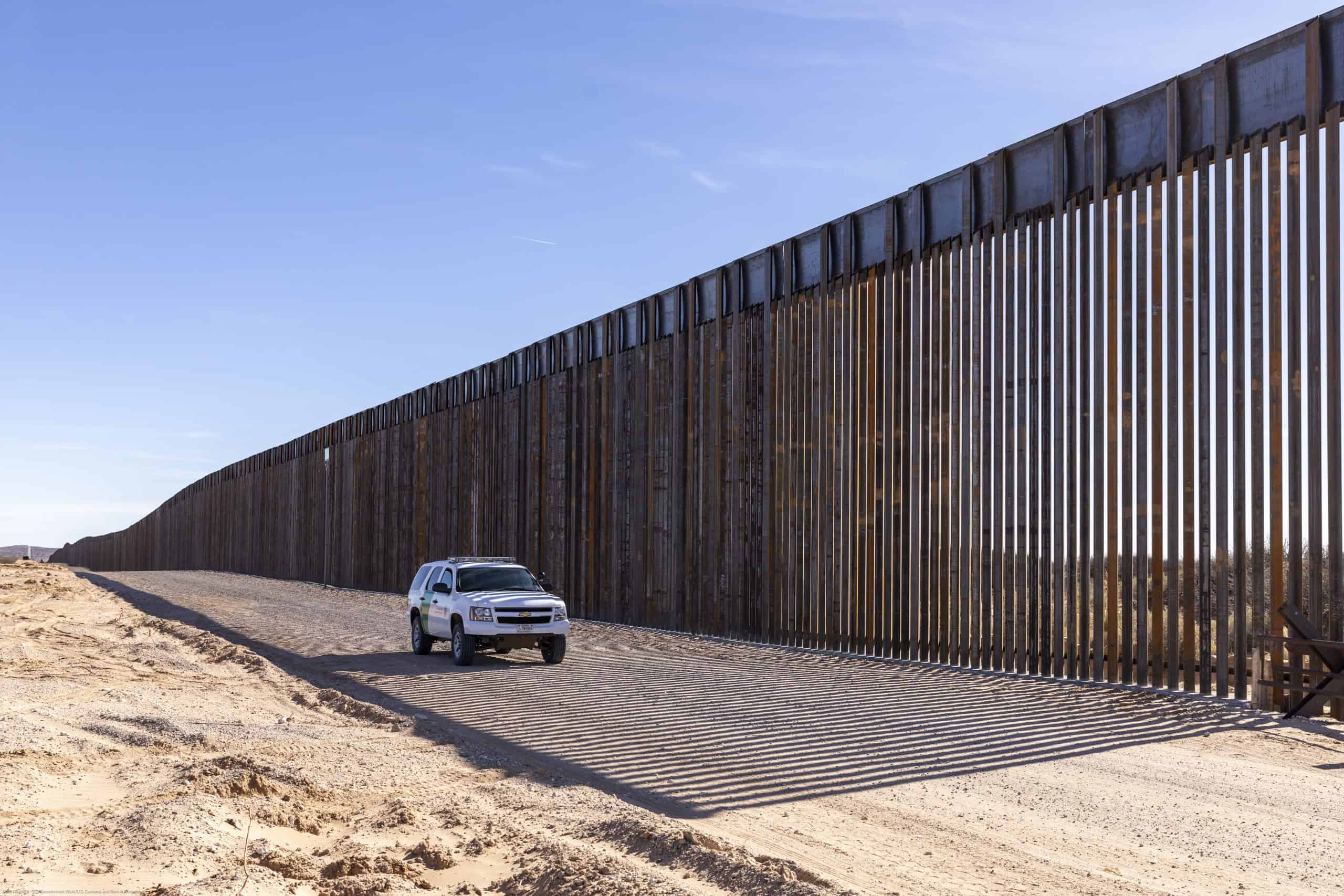 A white CBP truck patrol the US-Mexico border