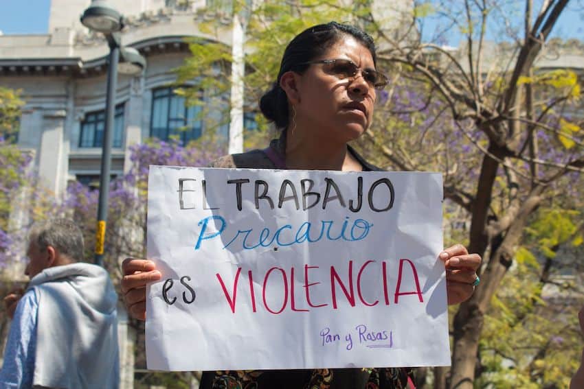 A protestor calling for equal employment protections