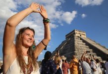 A tourist celebrates the equinox at the temple of Kulkulcan