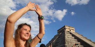 A tourist celebrates the equinox at the temple of Kulkulcan