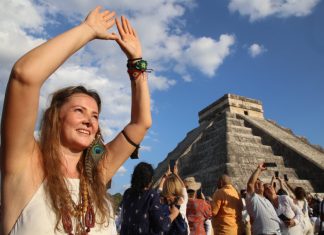 A tourist celebrates the equinox at the temple of Kulkulcan