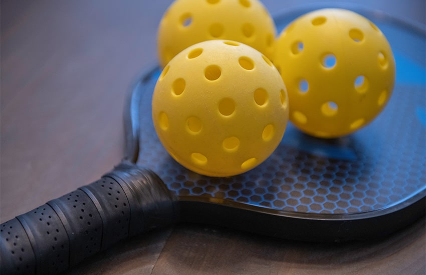 Pickleball racquet and balls