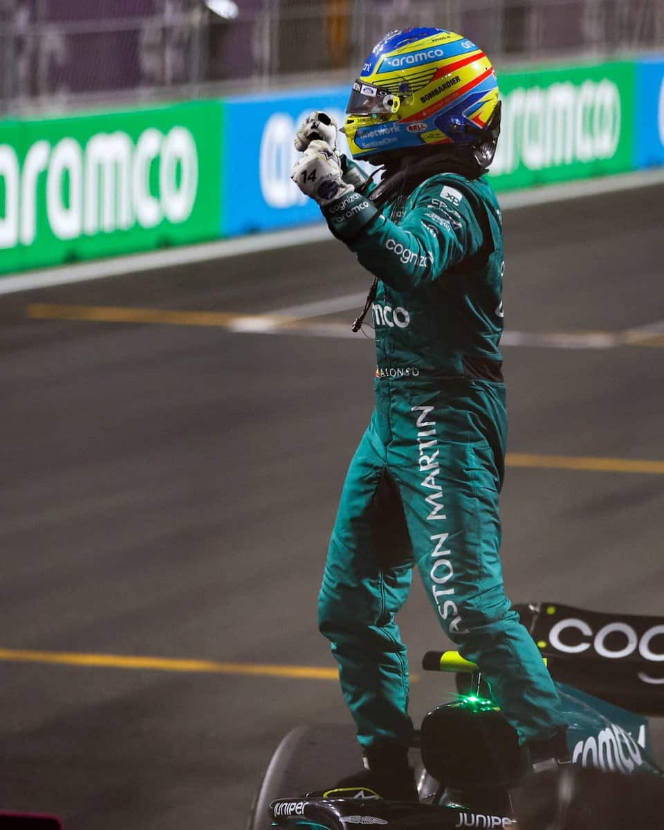 Fernando Alonso celebrates 3rd place in Saudi Arabia by leaping from his vehicle
