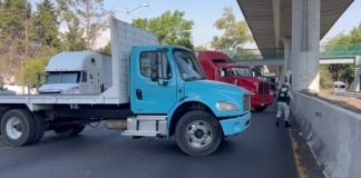 Trucks block a section of highway