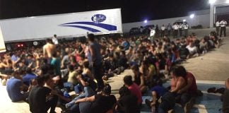 migrants left in a trailer on the side of the road in Veracruz, Mexico