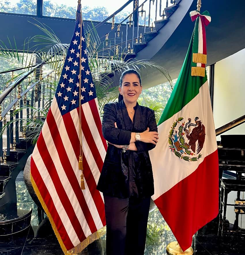 Karla de Lara with Mexican and U.S. flags