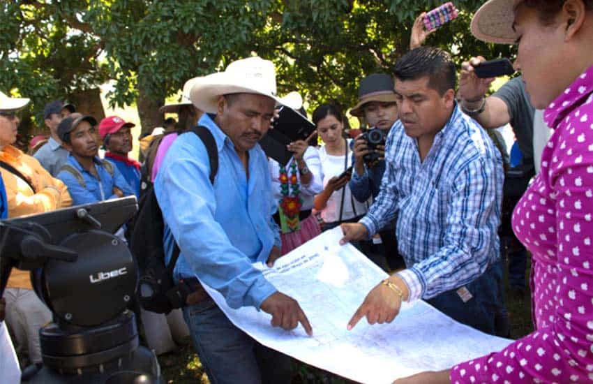 Indigenous Wixarika activists Miguel Vázquez, left, and Santos de la Cruz Carrillo, right, in Huajimic, Jalisco