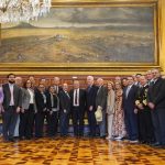 AMLO, Mexican officials, a U.S. delegation, and Ambassador Ken Salazar pose for a photo in the National Palace.