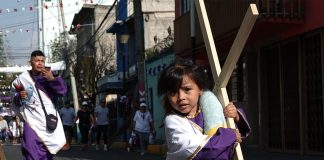 girl participating in 2023 Holy Week processions in Mexico City's Iztapalapa borough.