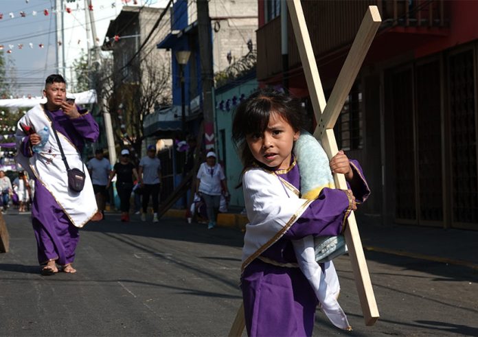 girl participating in 2023 Holy Week processions in Mexico City's Iztapalapa borough.