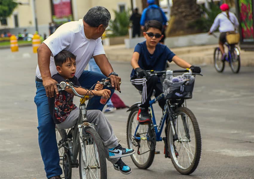 Mexican family biking in streets of Mexico City
