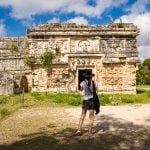 Woman looking at Chichén Itzá ruins in Yucatán