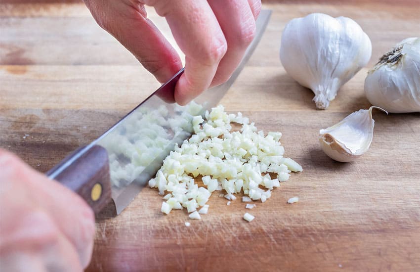 knife mincing garlic
