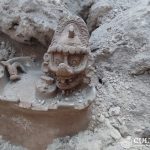 A statue of the Mayan god K'awiil