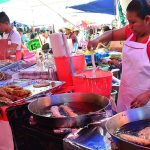 Frying fish at Zacualpan, Morelos' Sunday tianguis market.