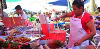 Frying fish at Zacualpan, Morelos' Sunday tianguis market.