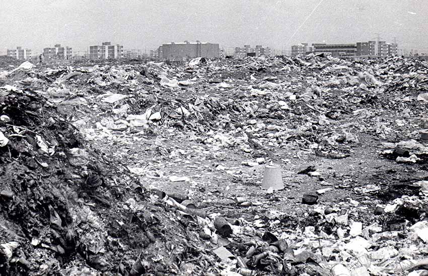 Old picture of Meyehualco, Mexico City landfill with Mexico City in the background