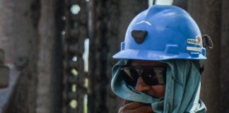 A miner looks on at rescue efforts in Pinabete