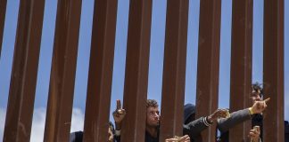 Migrants at the US-Mexico border in Tijuana on May 11.