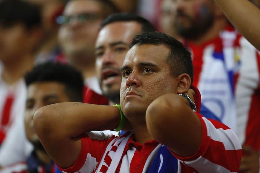 A Chivas fan looks sad as Tigres win 3-2