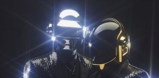 Daft Punk in their trademark helmets
