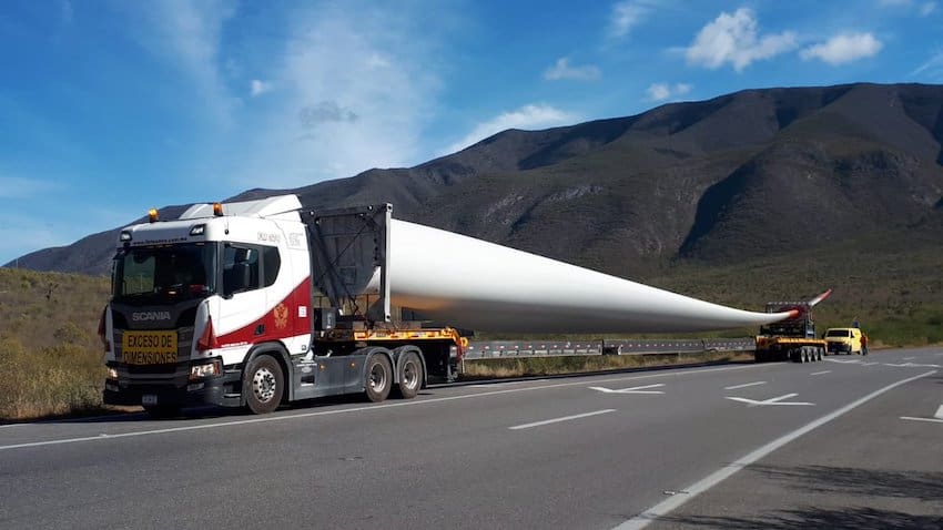 A truck delivers wind turbines