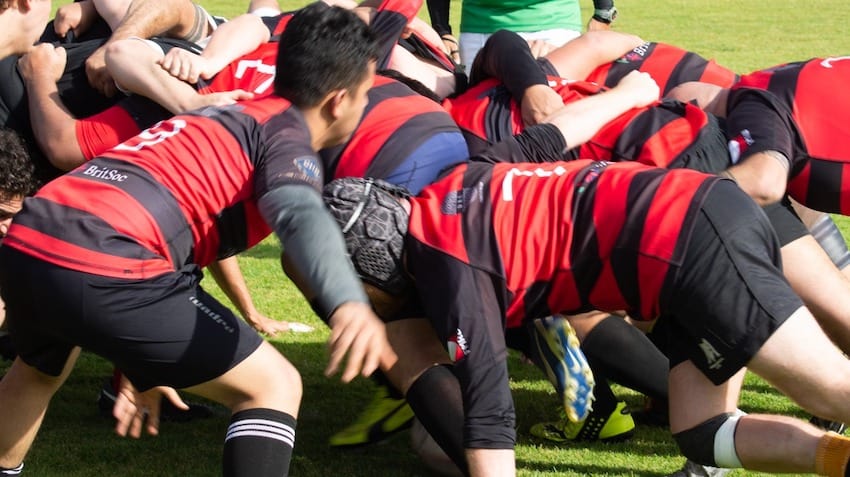 A scrum at a rugby match between Coyotes and Tazmania .