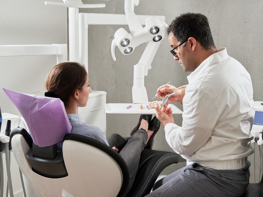 Dentist talks to patient