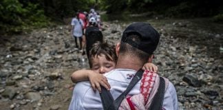 Migrant holding a child