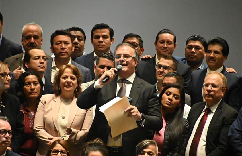 Marcelo Ebrard, center, announcing his impending resignation as Mexico's Foreign Affairs Minister