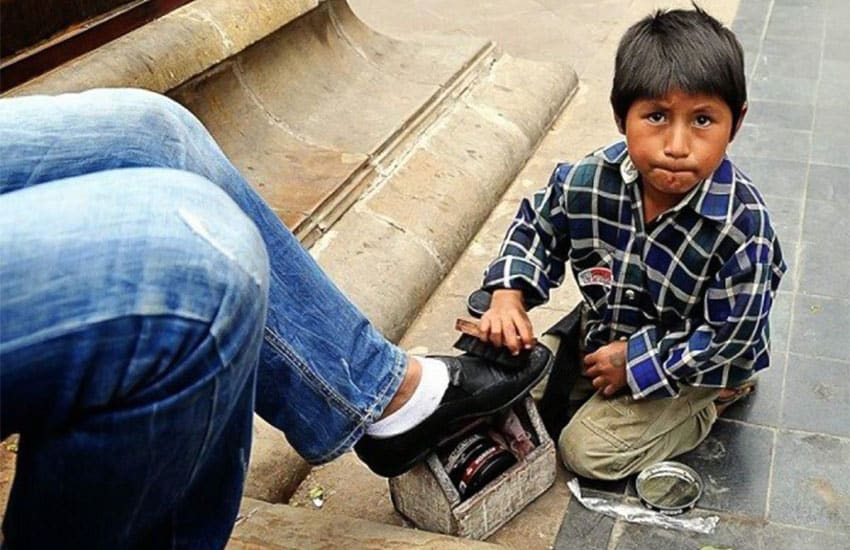 child shining shoes in Tabasco, Mexico