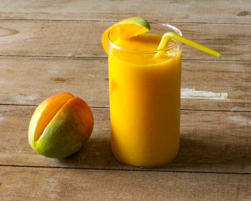 A mango smoothie with a mango.