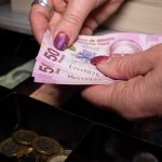 mexican money in a cash register