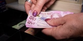 mexican money in a cash register