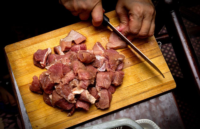 cutting meat for fajitas