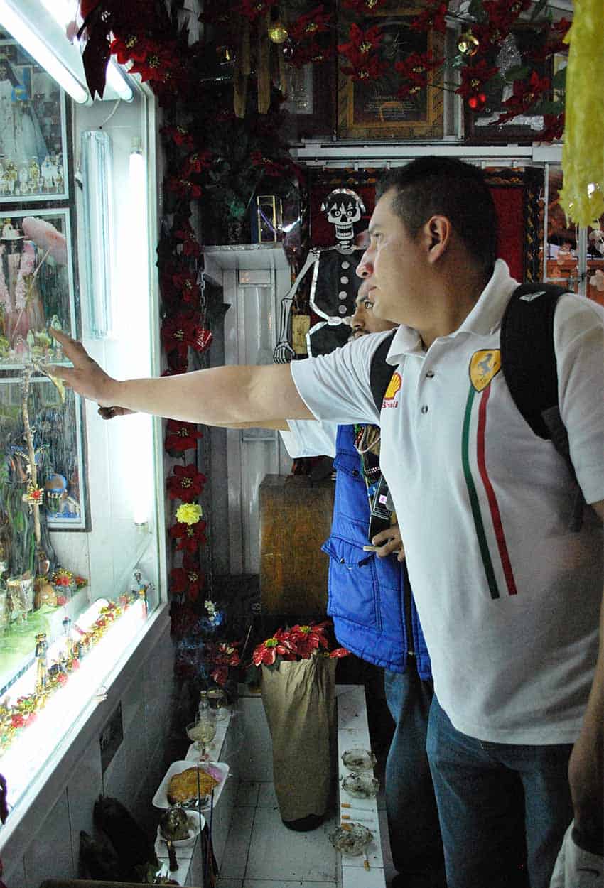 Believer at Tepito shrine to Santa Muerte