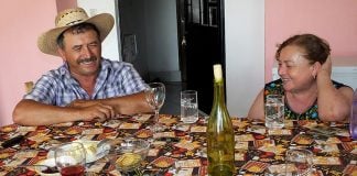 Serapio and Lupita at a table.