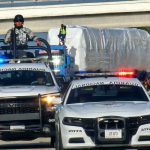 National Guard officers in patrol cars
