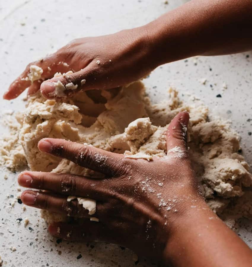 hands making tortilla dough